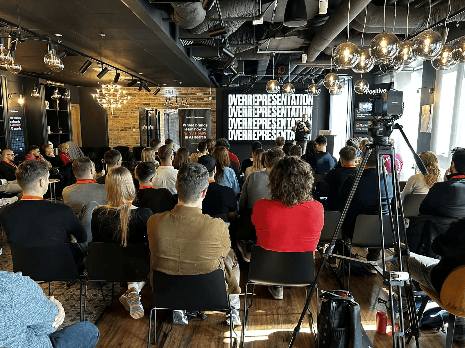 Audience at Surfer Visibility Club event where Jakub Sadowski presented on AI search visibility
